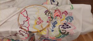 an embroidery in progress with colorful yarn