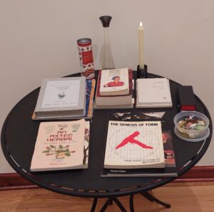a collection of art books on a round table